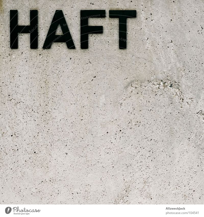 HAFT Haftstrafe gefangen Sicherheitsverwahrung einsperren Beton schwarz grau Typographie kleben Öffentlicher Dienst Detailaufnahme Buchstaben Schriftzeichen