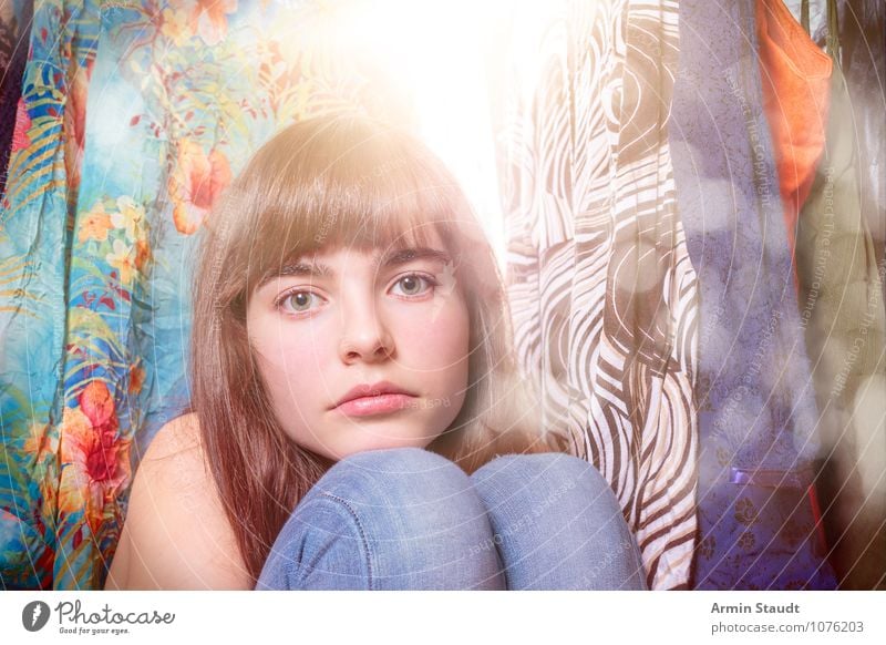 sad and lonely young woman sits in front of the wardrobe Lifestyle kaufen Stil Design schön Mensch feminin Junge Frau Jugendliche Gesicht 1 13-18 Jahre Kind