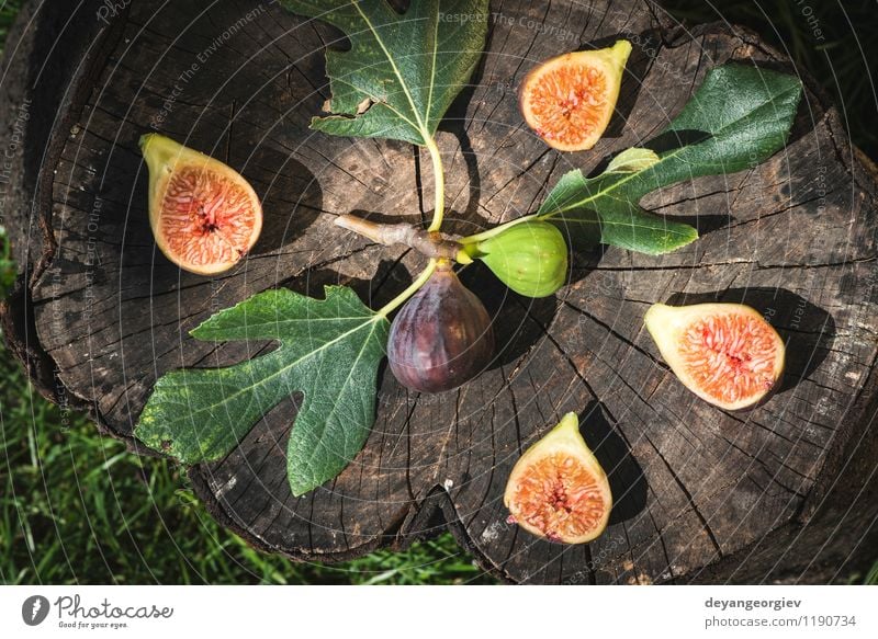 Feigen in gelber Schüssel Frucht Diät exotisch Natur Herbst Blatt frisch natürlich saftig grün rot reif Lebensmittel Holz organisch purpur süß Hintergrund