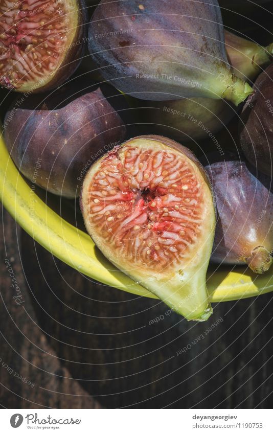 Feigen in gelber Schüssel Frucht Dessert Ernährung Schalen & Schüsseln exotisch Tisch Natur Herbst frisch natürlich saftig Lebensmittel rustikal süß Holz roh