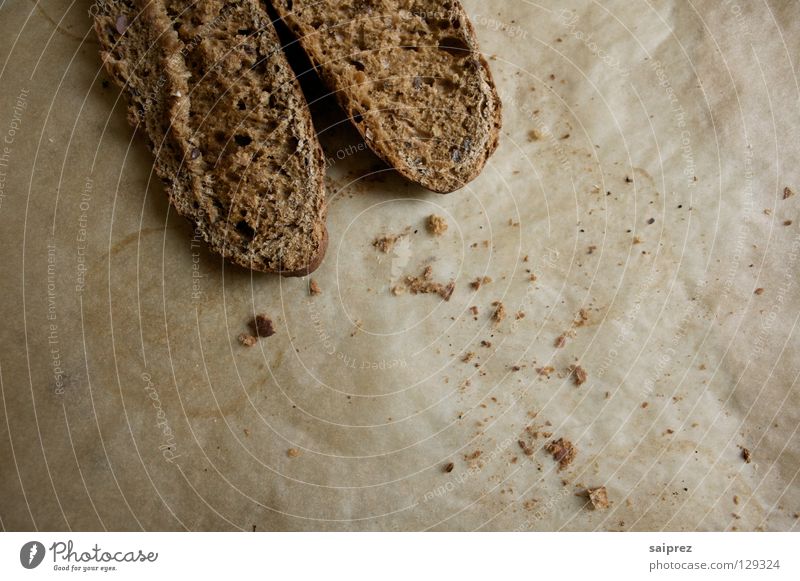 verkrümelt Brötchen Vollkorn rustikal Backwaren Lebensmittel Krümel Backpapier