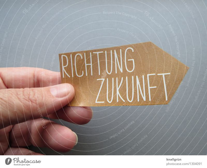 RICHTUNG ZUKUNFT Hand Finger Schriftzeichen Schilder & Markierungen festhalten Kommunizieren eckig braun grau Gefühle Stimmung Optimismus Neugier Hoffnung