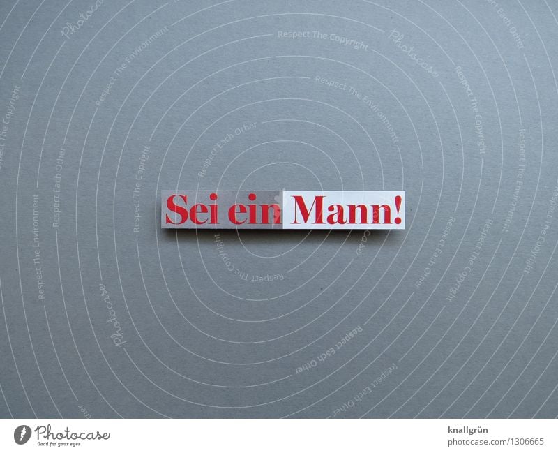 Sei ein Mann! Schriftzeichen Schilder & Markierungen Kommunizieren authentisch eckig Klischee grau rot weiß Gefühle Stimmung Entschlossenheit Erwartung Farbfoto