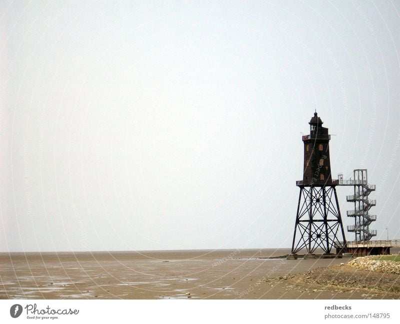 Leuchtturm bei Ebbe Architektur Wattenmeer Strand Wasser Meer Nordsee Deutschland Europa Leuchtfeuer Lampe Küste Gebäude Stahlverarbeitung Beleuchtung führen