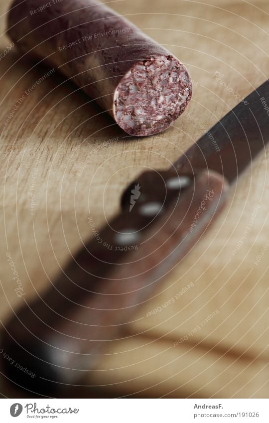 Alles hat ein Ende... Lebensmittel Fleisch Wurstwaren Ernährung Messer Küche Holz lecker grützwurst blutwurst Vesper Schneidebrett Metzger Metzgerei Farbfoto