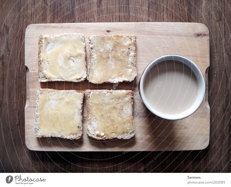 Kaffeepause Lebensmittel Honig Toastbrot Ernährung Frühstück Kaffeetrinken Getränk Heißgetränk Tasse Becher Schneidebrett Tisch heiß lecker Zufriedenheit