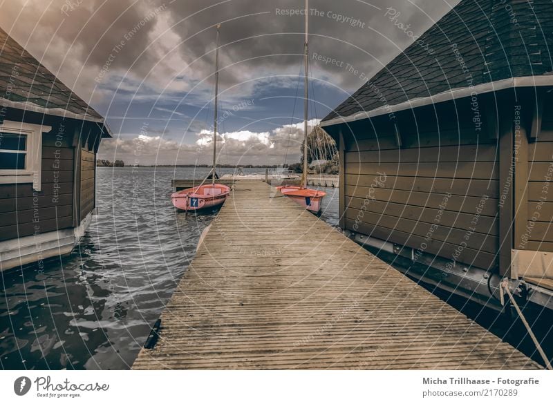 Bootshäuser und Segelboote am Steg Freizeit & Hobby Segeln Ferien & Urlaub & Reisen Tourismus Wellen Haus Bootshaus Natur Landschaft Wasser Himmel Wolken