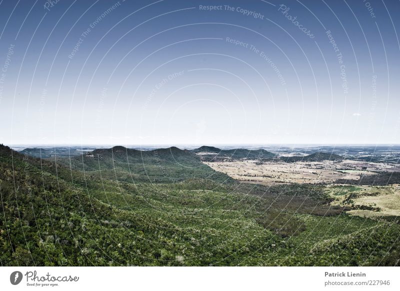 far behind Umwelt Natur Landschaft Urelemente Luft Himmel Wolkenloser Himmel Klima Wetter Schönes Wetter Wald Urwald Hügel Berge u. Gebirge natürlich wild blau