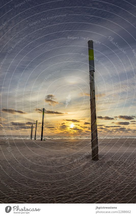 Sankt Peter Ording Sonnenuntergang Himmel Abenddämmerung Meer Landschaft Natur Licht Wasser Wolken Sand verträumt Ferne Unendlichkeit Holzpfahl Deutschland