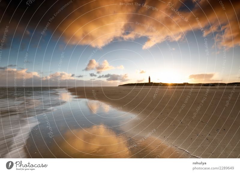 Sonnenaufgang an der Nordseeküste mit Leuchtturm, Texel Strand Meer Natur Landschaft Sand Himmel Wolken Sonnenuntergang Schönes Wetter Wellen Küste Fröhlichkeit