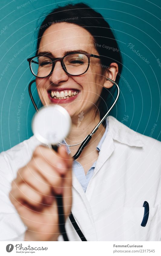 Female doctor fooling around with her stethoscope Arbeit & Erwerbstätigkeit Beruf Arzt feminin Junge Frau Jugendliche Erwachsene 1 Mensch 18-30 Jahre