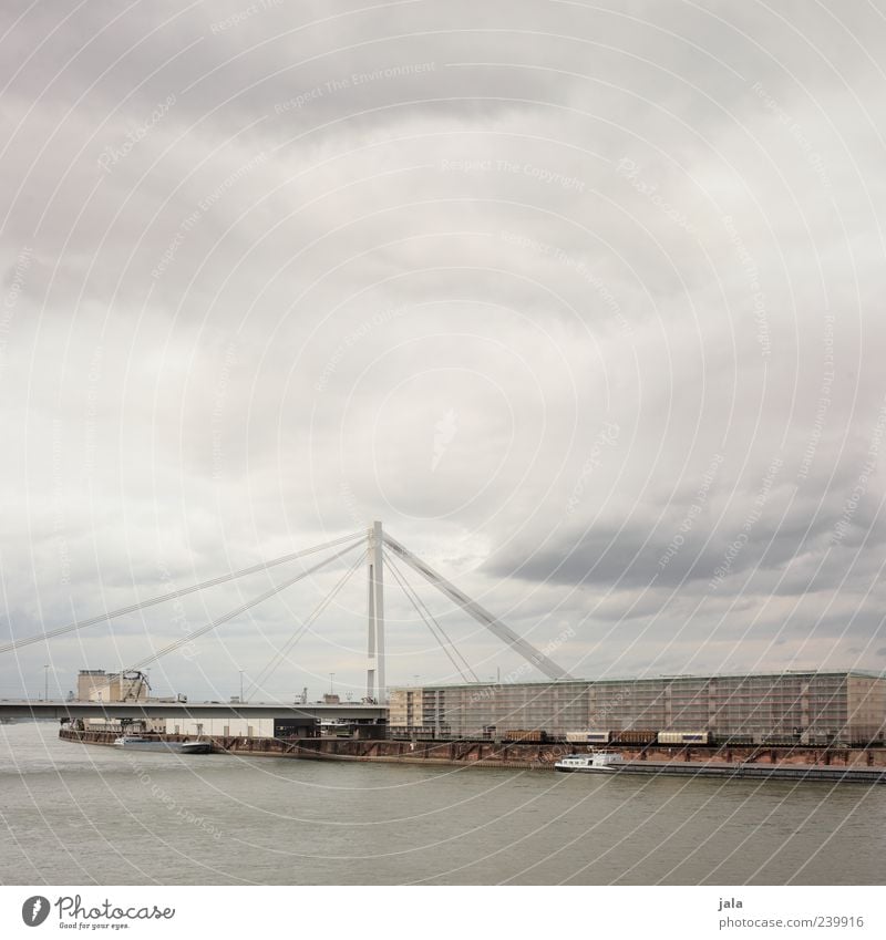 rheinbrücke Himmel Wolkenloser Himmel schlechtes Wetter Fluss Rhein Stadt Haus Industrieanlage Fabrik Brücke Bauwerk Gebäude Architektur Schifffahrt Güterzug