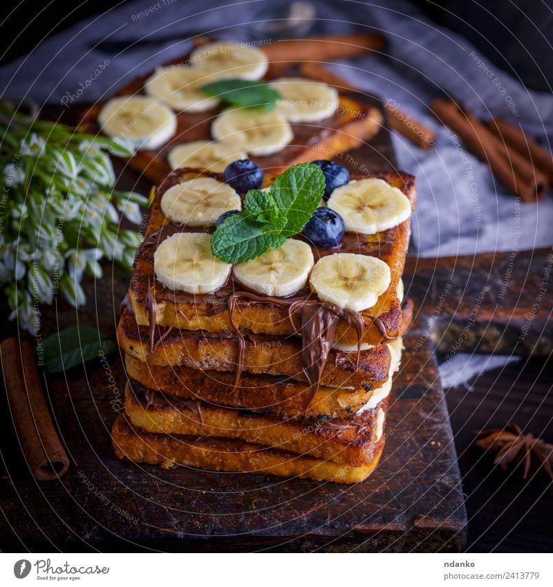 Brotscheiben mit Schokolade Frucht Dessert Süßwaren Ernährung Frühstück Blume Holz Essen frisch lecker oben Tradition Zuprosten Französisch Banane Hintergrund