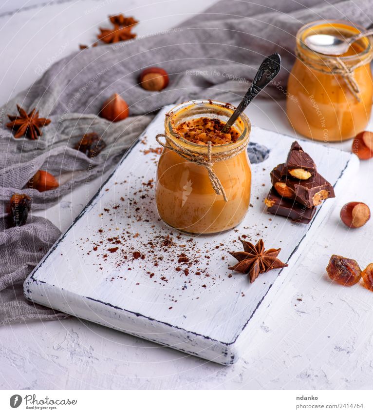 Karamell-Dessert Toffee Süßwaren Löffel Tisch Holz lecker oben braun Saucen Hintergrund Glas Gießen süß Zucker gebastelt Lebensmittel Klebrig Sirup