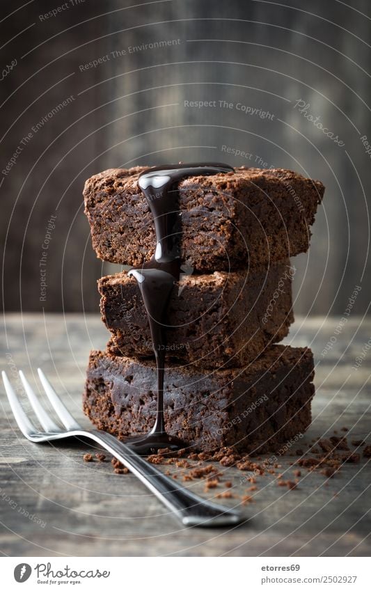 Schokoladenbrownie Lebensmittel Kuchen Dessert Süßwaren Frühstück frisch gut süß braun Brownie Snack Backwaren Gabel Teile u. Stücke liquide lecker Zucker