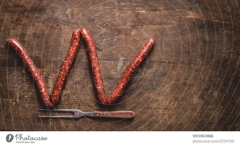 Buchstabe W gemacht mit Bratwürste Lebensmittel Wurstwaren Ernährung Gabel Stil Design Grill Hintergrundbild Text Symbole & Metaphern Buchstaben Bratwurst