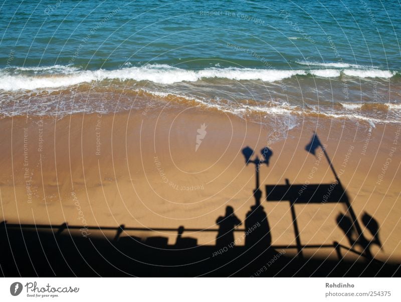 standing on the shadows of beachtown Ferien & Urlaub & Reisen Städtereise Sommerurlaub Sonne Strand Meer Wellen Mensch 1 Natur Sand Wasser Küste Blick blau gelb