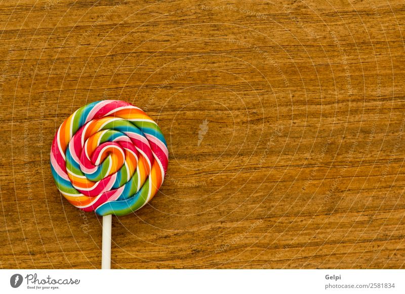 Schöner Lolli Dessert Essen Freude Kindheit Holz lecker retro rot weiß Farbe Bonbon Lebensmittel Lollipop süß Kies Zucker farbenfroh kleben Hintergrund ungesund