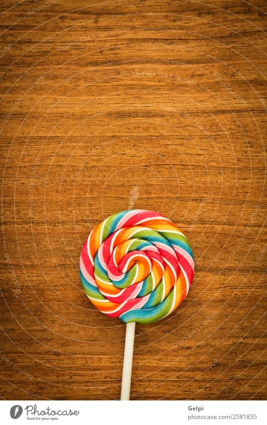 Schöner Lolli Dessert Essen Freude Kindheit Holz lecker retro rot weiß Farbe Bonbon Lebensmittel Lollipop süß Kies Zucker farbenfroh kleben Hintergrund ungesund