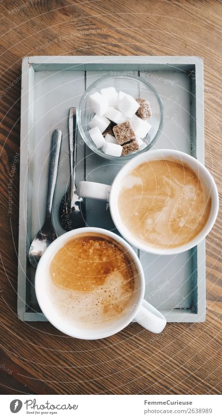 Two delicious cups of coffee on a small wooden tray Lebensmittel Getränk Heißgetränk Kaffee genießen Kaffeetrinken Kaffeetasse Frühstück Zucker Würfelzucker