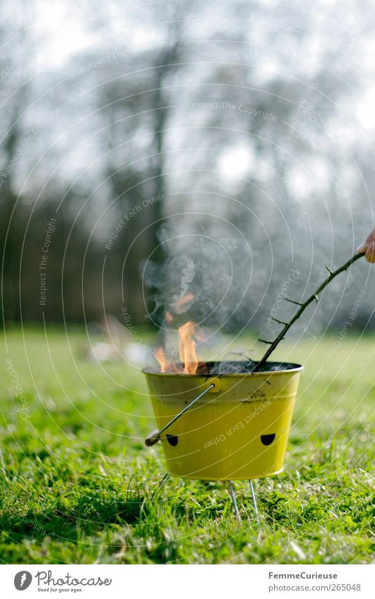 Barbecue season. Freizeit & Hobby Garten Abenteuer Grillsaison Grillen Stock Ast Flamme Rauch Feuer Grillkohle gelb Abgas Wiese Sportrasen Gras Park Picknick