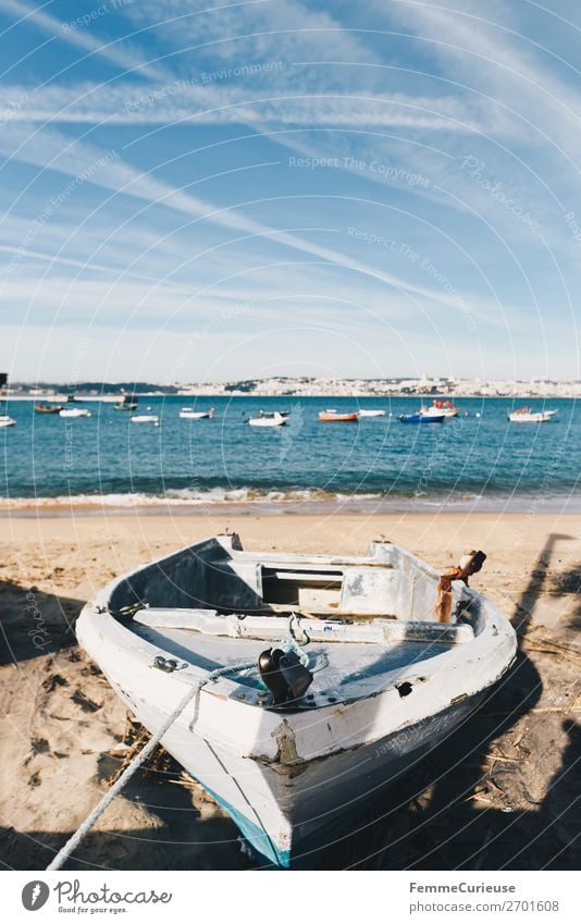 Old fishing boat on the beach in Trafaria Verkehrsmittel Schifffahrt Fischerboot Ferien & Urlaub & Reisen Portugal alt Strand Kondensstreifen Himmel Tajo Angeln