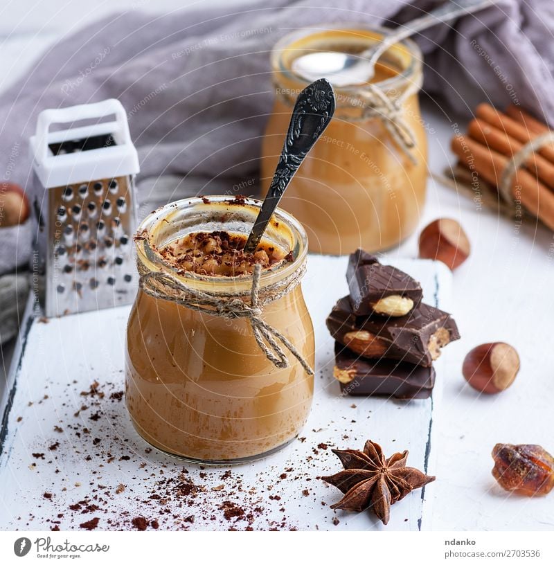 Karamell-Dessert Toffee im Glasglas Süßwaren Kräuter & Gewürze Löffel Tisch Holz frisch lecker braun Tasse Hintergrund Sahne Lebensmittel gebastelt Zutaten