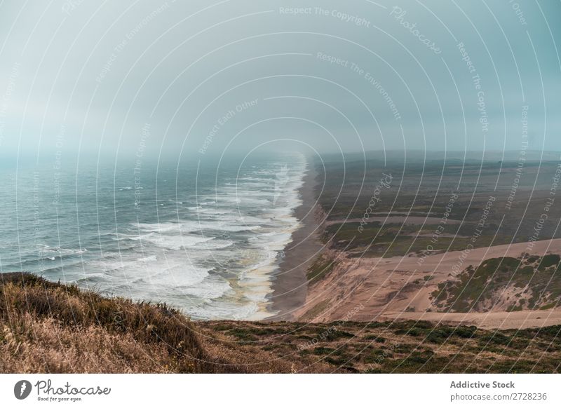 Perspektivische Ansicht der Küstenlinie Landschaft Perspektive Gezeiten Panorama (Bildformat) dramatisch Natur Erholung Sand Tourismus Meer Berge u. Gebirge