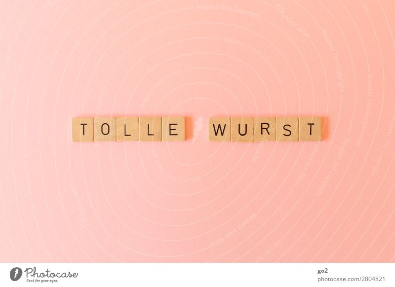 Tolle Wurst Fleisch Wurstwaren Ernährung Spielen Holz Schriftzeichen lustig rosa Freude Kommunizieren skurril Humor Redewendung Ironie Sprache Farbfoto