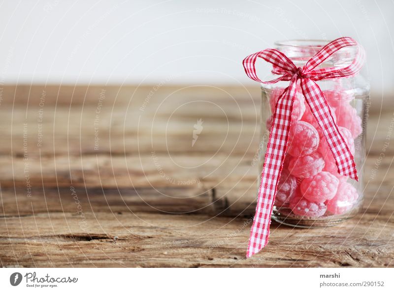 sweets for my sweets Lebensmittel Süßwaren Ernährung Essen rosa Glas Schleife Verpackung Holztisch Geschenk Bonbon süß lecker Zucker Kalorie Jahrmarkt