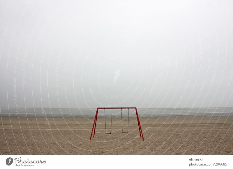 Playground Spielplatz Schaukel Sand schlechtes Wetter Küste Strand Nordsee Langeoog Menschenleer Einsamkeit Angst Endzeitstimmung Ferne Farbfoto Gedeckte Farben