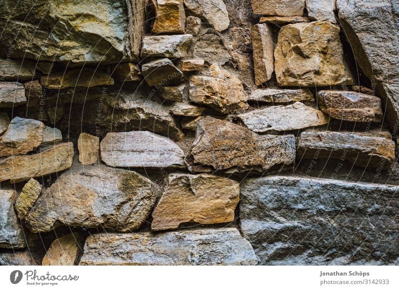 Textur Naturstein Fassade Außenaufnahme Jahreszeit Outdoor herbst natur Wand Steinmauer Mauer Mauerstein Farbfoto Tag Menschenleer alt Natursteinfassade