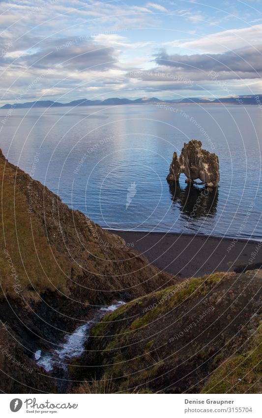 Troll rock in Iceland stands in the sea Ferien & Urlaub & Reisen Tourismus Abenteuer Expedition Sommer Strand Umwelt Natur Landschaft Klima Klimawandel