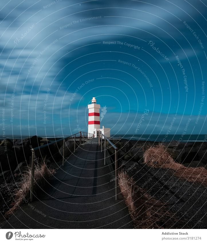 Leuchtturm in Island Garður Licht Himmel Meer weiß Natur blau Wasser Landschaft Tourismus Küste Atlantik Ferien & Urlaub & Reisen isländisch Europa Wolken