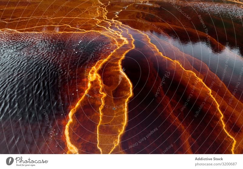 Leuchtend orangefarbene Spritzer in der Natur Überleitung Hintergrundbild Berge u. Gebirge abstrakt Felsen geologisch Orange strömen Stein gelb schön natürlich