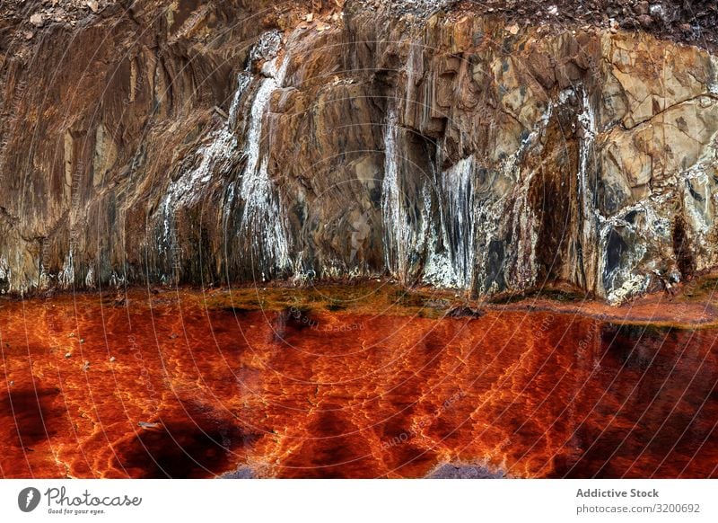 Leuchtend orangefarbene Spritzer in der Natur Überleitung Hintergrundbild Berge u. Gebirge abstrakt Felsen geologisch Orange strömen Stein gelb schön natürlich