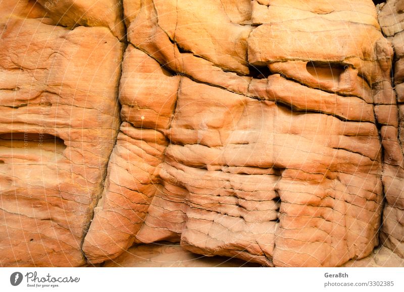 Textur eines orangefarbenen Steinfelsens in einer farbigen Schlucht aus nächster Nähe Berge u. Gebirge Natur Felsen hell Farbe Hintergrund blanko detailliert