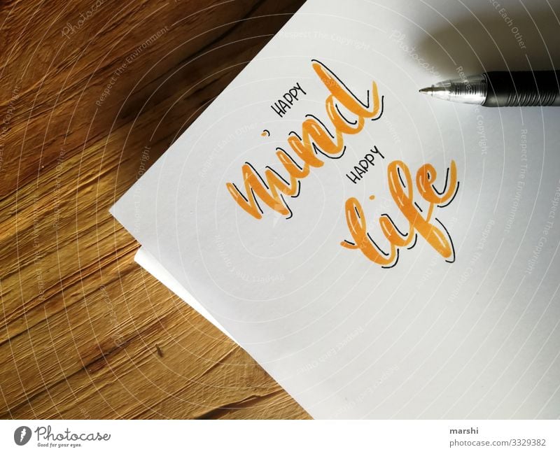 happy mind, happy life Lifestyle Stil Design Freude Geld Freizeit & Hobby Basteln Tisch Schreibwaren Papier Zettel Schreibstift Zeichen Schriftzeichen