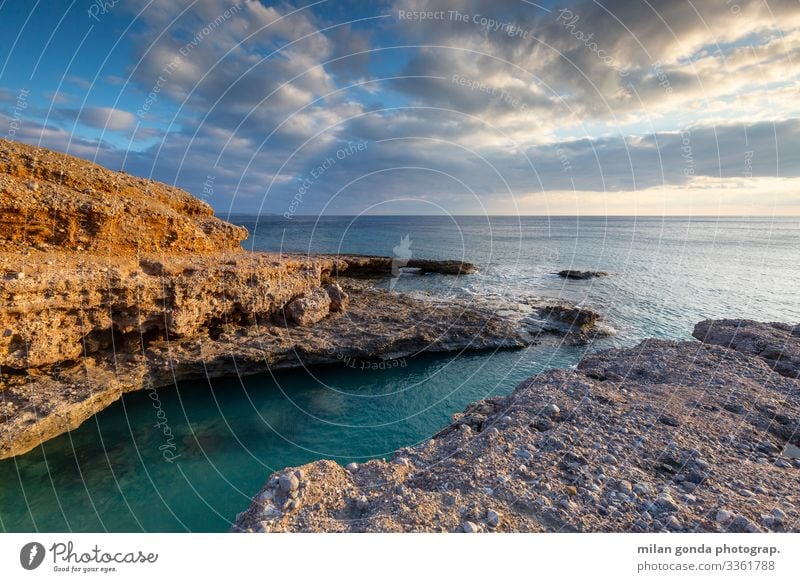 Kreta. Meer Natur Küste blau orange Europa mediterran Griechenland Crete Lasithi Goudouras Atherina-Strand Felsbogen Meereslandschaft Klippe Abend