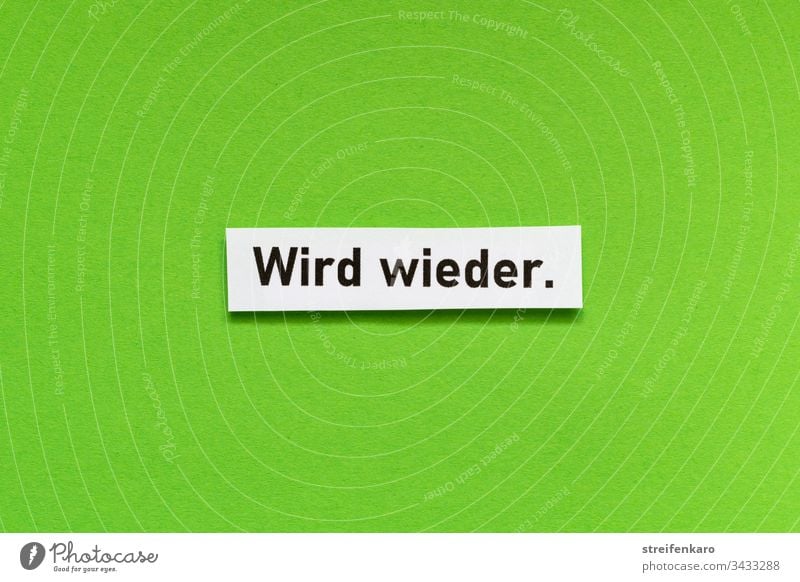 Optimistischer Schriftzug „Wird wieder“ vor grünem Hintergrund Optimismus Farbfoto Hoffnung Glück positiv Lebensfreude Gefühle Freude Schriftzeichen