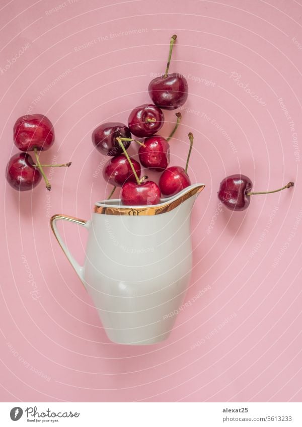 Kirschen in weißer Schale auf rosa Hintergrund Ackerbau Beeren Schalen & Schüsseln Farbe essen Lebensmittel frisch Frische Frucht Garten Feinschmecker