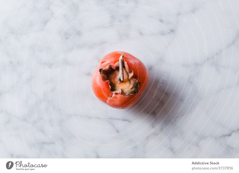 Frische Dattelpflaume auf dem Tisch in der Küche Persimone Frucht Vitamin reif frisch gesunde Ernährung süß Sehne Diät Nährstoff lecker hell Gesundheit