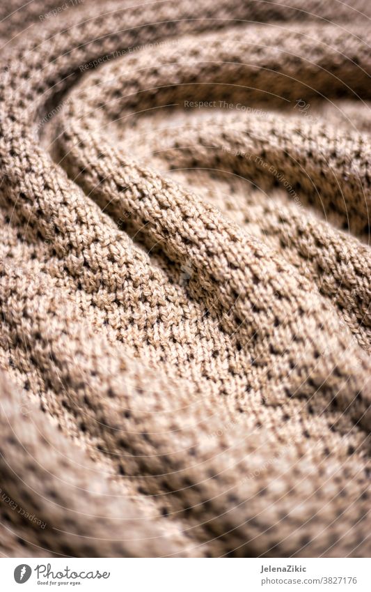 Gestrickte beige Deckentextur Hintergrund stricken Muster warm Textur Wolle Mode Makro Wollstoff gewebt Kaschmiri weich Gewebe Faser Winter dekorativ natürlich