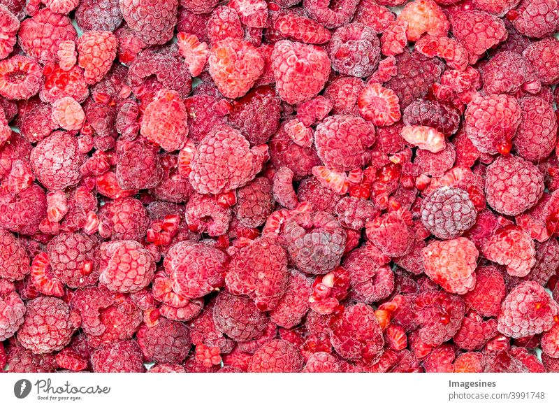 Gefrorene Himbeeren Hintergrund von oben Hintergründe Beeren Beerenfrüchte Nahaufnahme kalt kalte Temperatur Farbbild Obst Produkt Dessert top view Essen