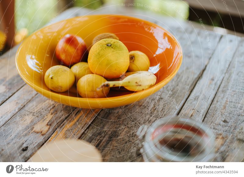 Schale mit Zitrone, Apfel und Banane Ackerbau Schalen & Schüsseln Zitrusfrüchte Farbe farbenfroh dekorativ Dessert Diät Essen & Trinken frisch Frucht Brille