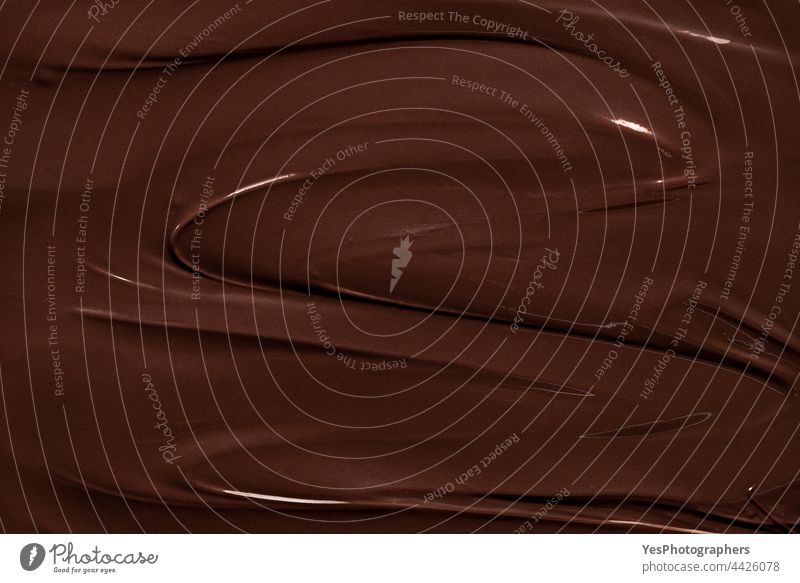 Geschmolzene Schokolade Textur, Vollbild. Dunkle Schokolade Strudel Hintergrund obere Ansicht Überfluss Bäckerei backen bitter schwarz braun Weihnachten