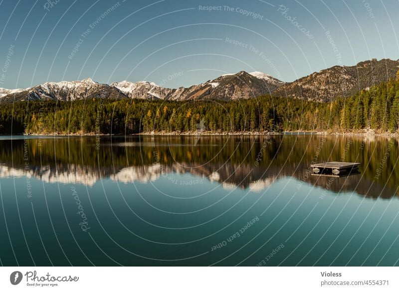 Spiegelbild am Bergsee IV Steine Ufer Bayern Eibsee Berge garmisch partenkirchen Wettersteingebirge Spiegelung Alpen Zugspitze Skiort Grainau Erholung Urlaub