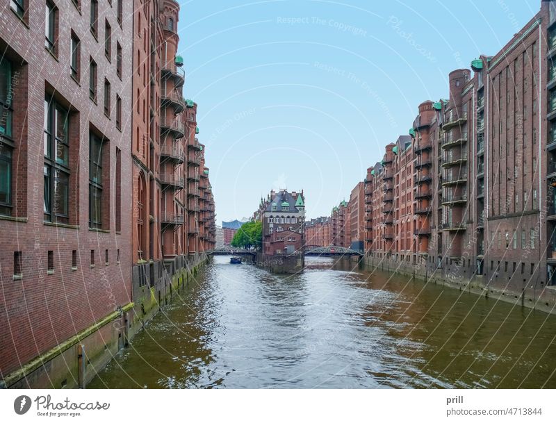 Speicherstadt in Hamburg speicherstadt hamburg warehouse district germany old historic hafen city canal bridge facade house facade brick brick wall