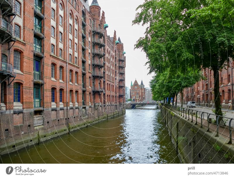 Speicherstadt in Hamburg speicherstadt hamburg warehouse district germany old historic hafen city canal bridge facade house facade brick brick wall