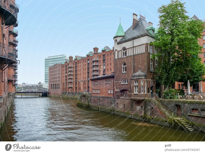 Speicherstadt in Hamburg speicherstadt hamburg warehouse district germany old historic hafen city canal bridge facade house facade brick brick wall